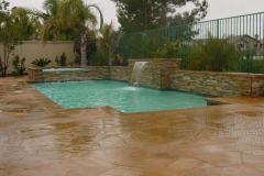 contemporary-pool-with-sheer-descent-waterfall-and-raised-spa