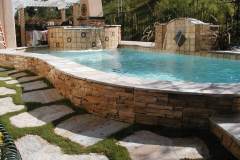 raised-pool-and-spa-with-ledger-stone-and-sheer-descent-water-feature