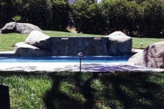 completed-pool-and-spa-renovation-with-added-rock-work-and-tile-spillways