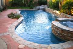 completed-remodel-with-added-spa-waterfall-and-raised-ledgerstone-pool-wall
