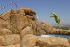 carved-rock-water-feature-with-sheer-descent-and-slide